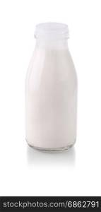 Open glass bottle with milk with shadow isolated on white background