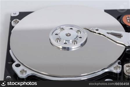 Open hard drive with magnetic disk and writing head.. Open hard drive with magnetic disk and writing head