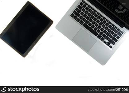 Open laptop and tablet isolated on white background with copy space