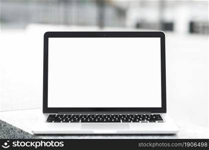 open laptop showing blank white screen display bench against blurred background. High resolution photo. open laptop showing blank white screen display bench against blurred background. High quality photo
