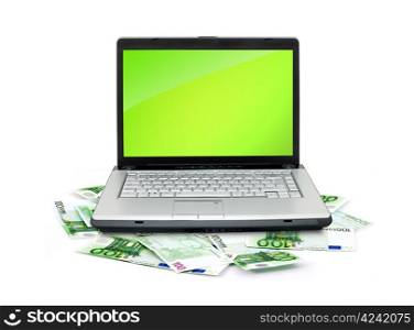 Open laptop with money isolated on white background