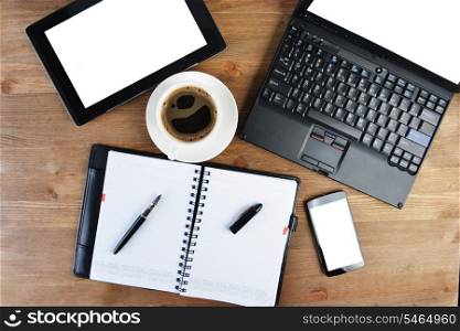 open notebook, mobile phone, pen and cup of coffee