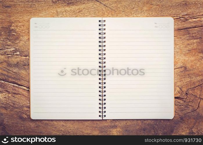 open notebook on old wooden table