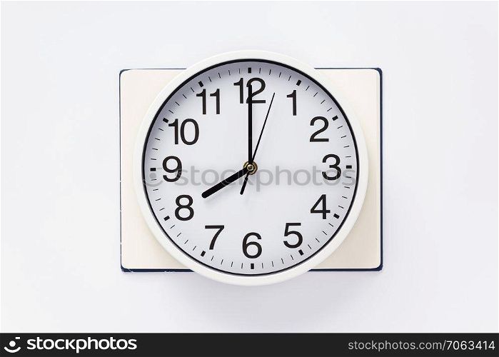 open notebook or book with clock watch on white  background, top view
