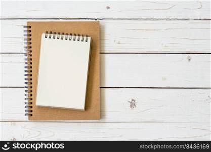 Open notebook with blank pages and on wood table