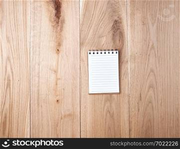 open notebook, wooden background 