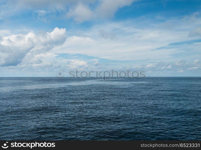 Open ocean and cloudy sky. Open ocean and cloudy sky. Summer tropical travel. Open ocean and cloudy sky