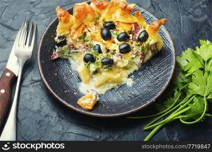 Open pie with olives, mushrooms and sausage.Salty pies. Salty pastries, meat pie