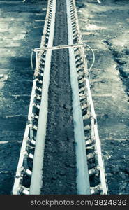 Open pit. Opencast brown coal mine. Belt conveyor as industrial detail.