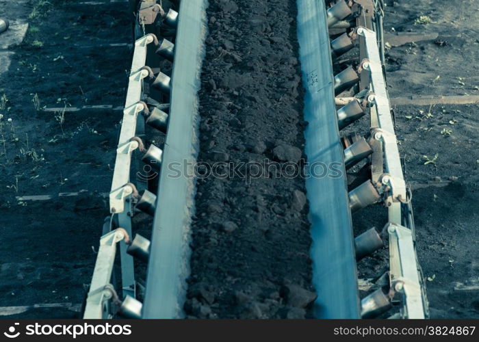 Open pit. Opencast brown coal mine. Belt conveyor as industrial detail.