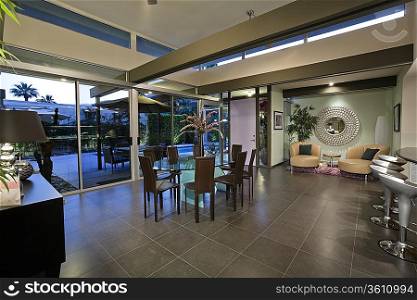 Open plan home interior with areas designated for dining and relaxing