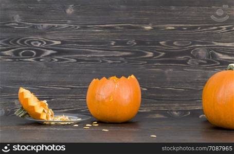 open pumpkin tops in preparation for the celebration of Halloween, close-up of orange vegetables. open pumpkin tops