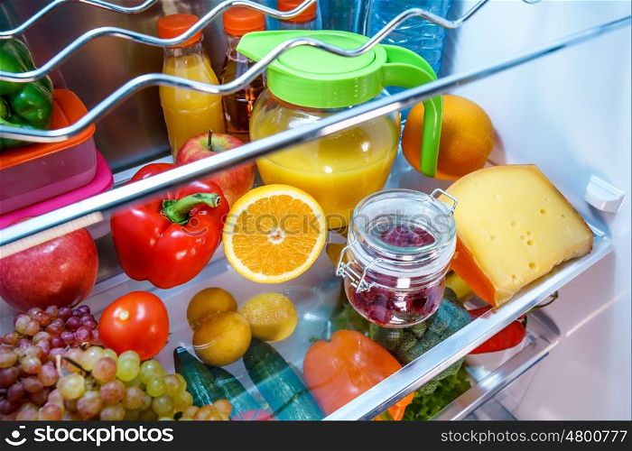 Open refrigerator filled with food. Healthy food.