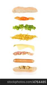 open sandwich, floating sandwich, hot dog sandwich with mushrooms, sausage, bacon, cheese, chips, lettuce and tomato