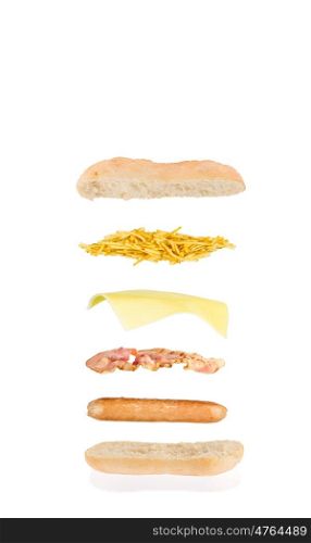 open sandwich, floating sandwich, hot dog sandwich with sausage, bacon, cheese and chips