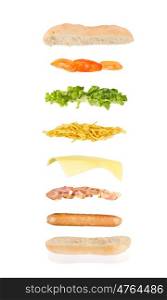 open sandwich, floating sandwich, hot dog sandwich with sausage, bacon, cheese, chips, lettuce and tomato