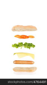 open sandwich, floating sandwich, hot dog sandwich with sausage, cheese, lettuce and tomato