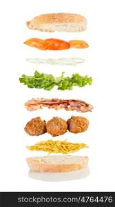 open sandwich, floating sandwich, meat ball sandwich with chips, meatballs, bacon, lettuce, onions and tomato