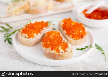 Open sandwiches with red salmon caviar