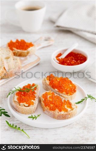 Open sandwiches with red salmon caviar