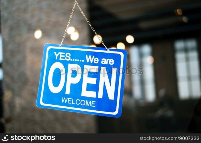 open sign broad through the glass of window at coffee shop