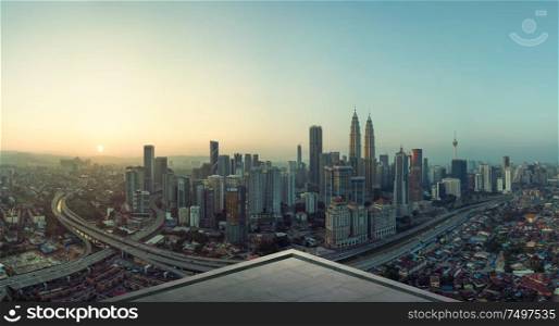 Open space balcony with Kuala Lumpur cityscape skyline view .