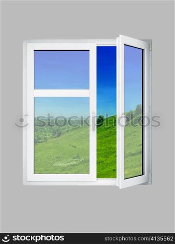 Open window at grey wall and the summer landscape