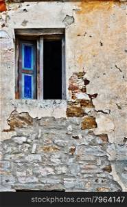 Open Window on the Dilapidated Facade of the Old Italian House