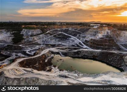 opencast mining quarry with beautiful sunlight and cloudy sky Aerial view industrial