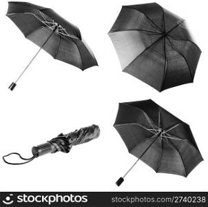 Opened and closed black umbrella isolated over white background