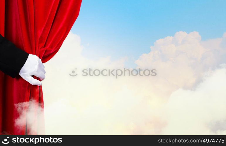 Opened curtain. Hand of businessman opening red velvet curtain