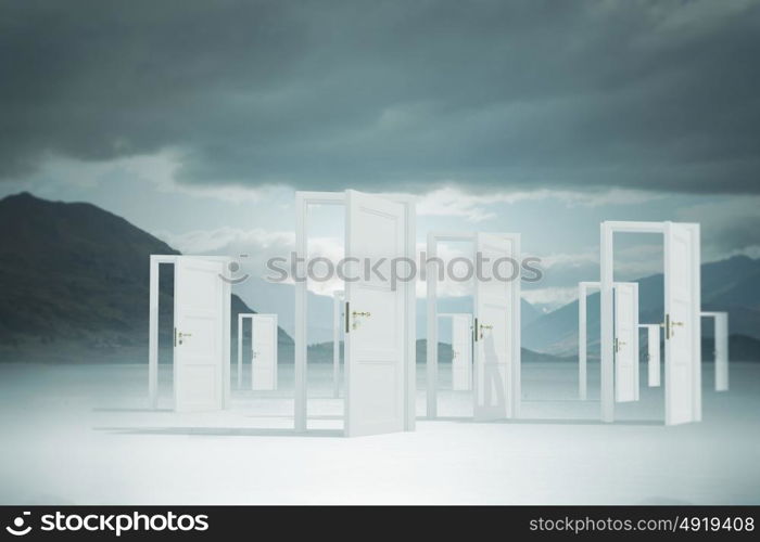 Opened doors in field. Conceptual image with opened doors as new way entrance to new world