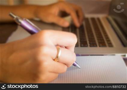 Opened laptop on wooden work table, stock photo