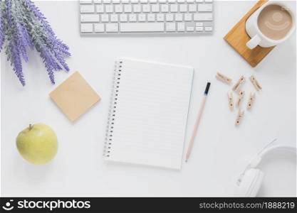 opened notebook near stationery white table with gadgets coffee cup . Resolution and high quality beautiful photo. opened notebook near stationery white table with gadgets coffee cup . High quality and resolution beautiful photo concept