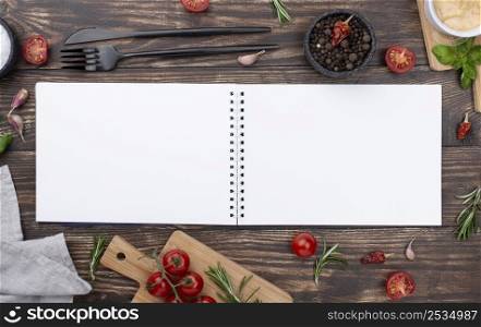 opened notebook with ingredients beside