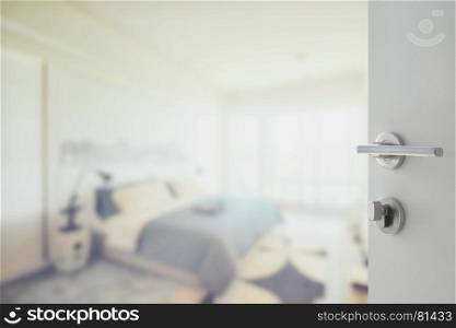 opened white door to abstract background of modern bedroom interior