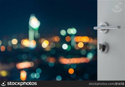 opened white door to abstract bokeh background aerial view of bangkok downtown cityscape at night