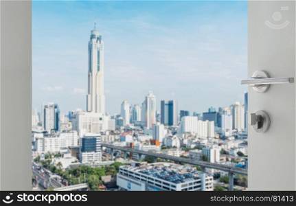 opened white door to bangkok city skyline with modern buidings as background