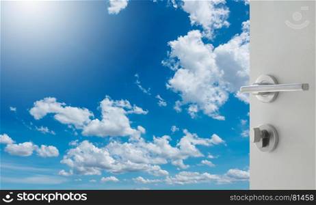 opened white door to beautiful sky with clouds