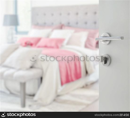 opened white door to blurred colorful pillows on bed in a modern house