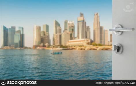 opened white door to blurred skyline of singapore cityscape as background