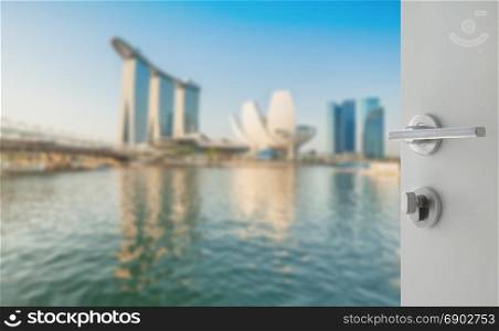 opened white door to blurred skyline of singapore cityscape as background