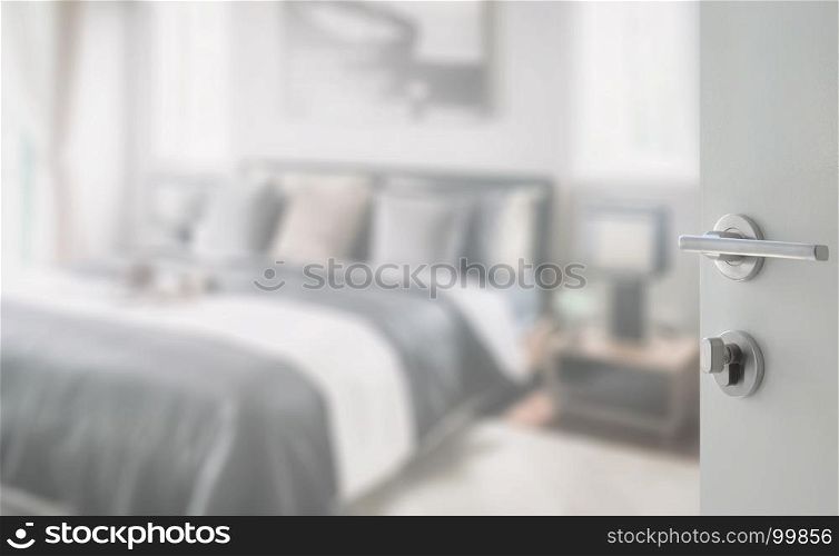 opened white door to modern bedroom in black and white color tone