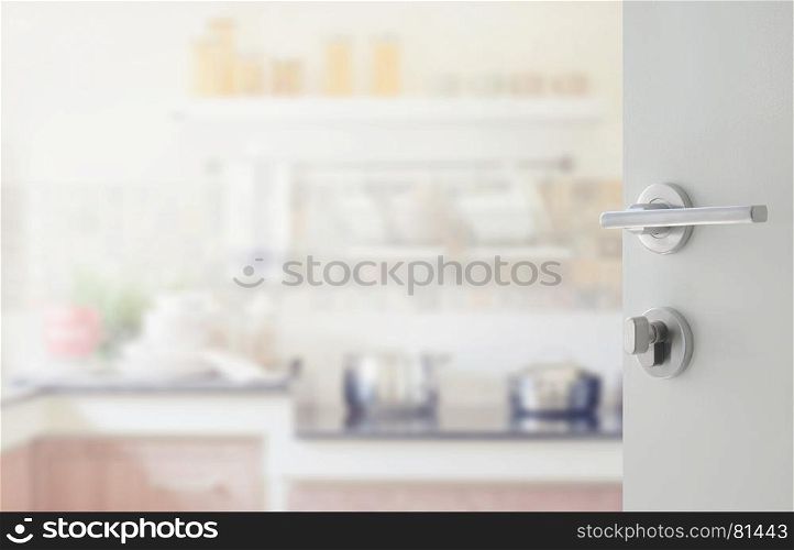 opened white door to modern kitchen interior as background