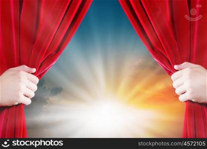 Opening curtain. Close up of hand opening red curtain. Place for text