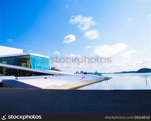 Opera house in Oslo Norway, white building towards fresh blue sky at harbor