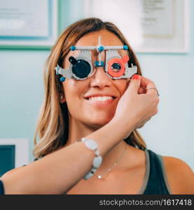 Ophthalmologist doing test with visual chart  