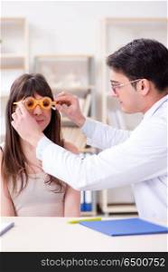 Ophthalmologist is checking up patient in eye doctor hospital
