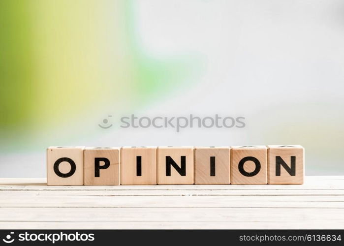 Opinion sign on a wooden indoor desk