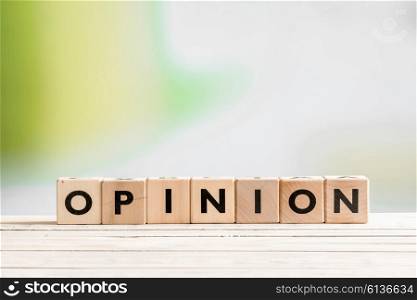 Opinion sign on a wooden indoor desk